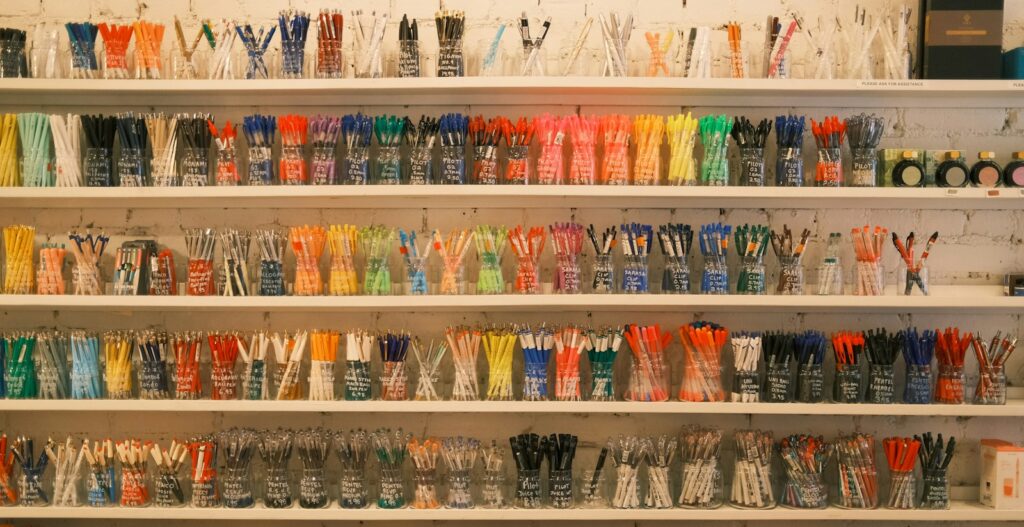 a shelf filled with lots of different colored toothbrushes