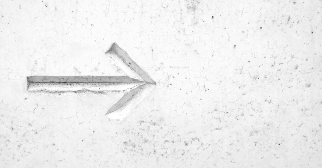 right arrow sign on wall