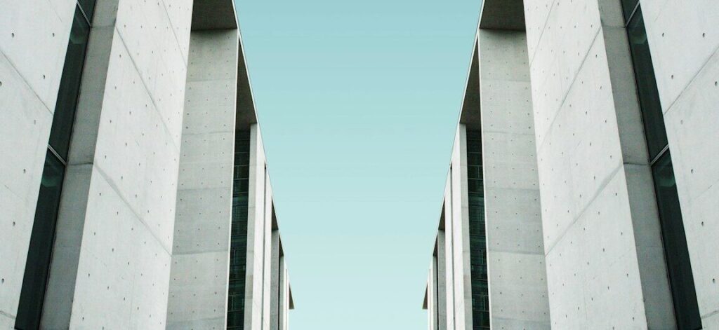 two white buildings facing each other