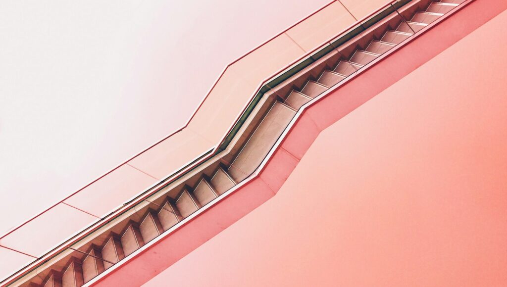white staircase with pink background