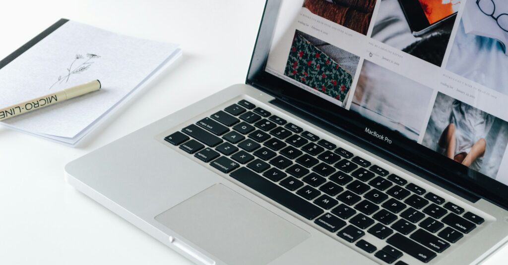 Macbook Pro besides white book